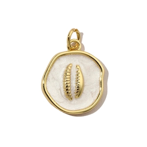 Detailed close-up of a round gold pendant with white enamel inlay and relief design