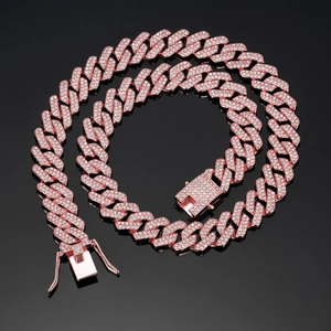 Detailed macro view of 14mm rose gold Cuban link necklace with crystal pavé and box clasp