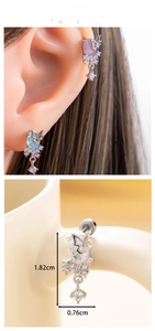 Macro view of butterfly zircon earrings with tassels and precise size measurements