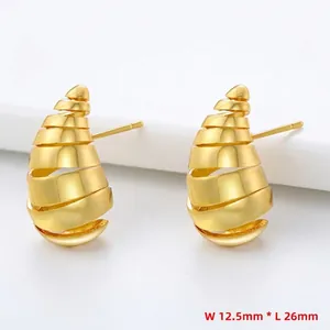 Detailed view of hollow spiral gold earrings measuring 12.5mm width and 26mm length
