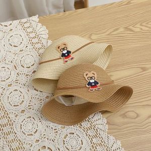 Kids wide-brimmed straw sun hat featuring cute bear patch and glasses decoration