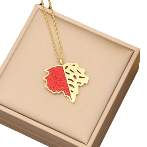 Gold maple leaf necklace with red crystals and hollow design in a beige jewelry box