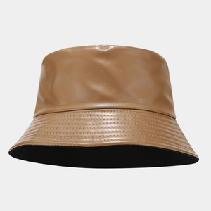 Close-up of caramel PU leather bucket hat with detailed stitching and black inner lining