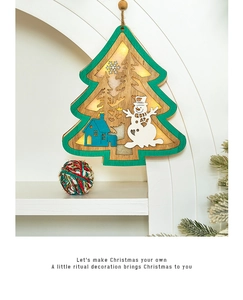 Close-up of wooden Christmas tree LED ornament with snowman and glowing warm light