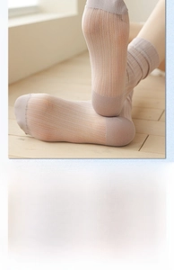 Detail of light pink velvet mid-calf socks with breathable mesh and vertical stripes