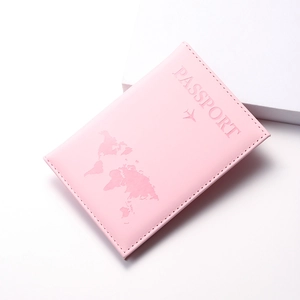 Pink PU leather passport holder with embossed map design on clean white background