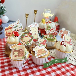 Christmas bear and reindeer cupcake toppers on festive muffins with red checkered background