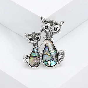 Vintage silver double cat brooch with iridescent abalone shell inlay and black rhinestones