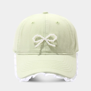 Mint green baseball cap with pearl bow decoration and white lace trim for women