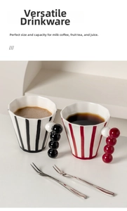 Detail view of retro striped ceramic mugs with unique creative ball-shaped handles