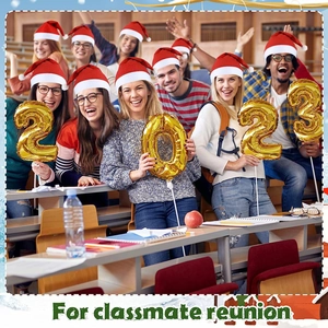 Group of students in Santa hats holding 2023 gold foil balloons for a reunion party