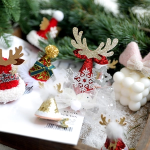 Christmas antler hair clips with sequins and lace in a warm festive holiday setting