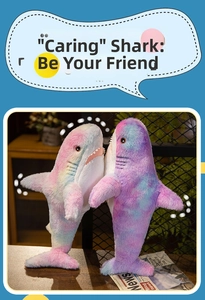 Detail of plush shark toys with soft gradient rainbow fur and embroidered facial features