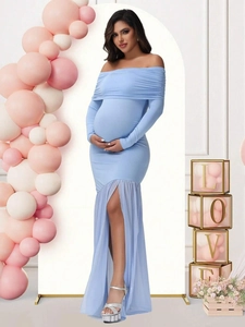 Detail of light blue off-shoulder maternity dress with mesh split hem in a baby shower setting