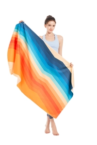 Macro detail of microfiber quick-dry beach towel with colorful chevron pattern