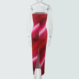 Detail of red and pink gradient strapless dress with back ruching and hem slit