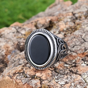 Retro men's ring with black oval agate and ornate silver-tone carving on tree bark