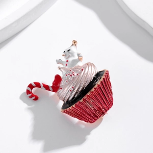 Christmas cupcake brooch with pink frosting, white snowman, and red candy cane detail