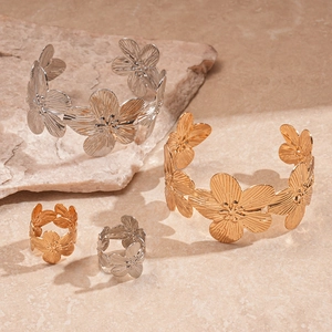 Artistic gold and silver metallic flower cuff bracelets and matching rings set for women