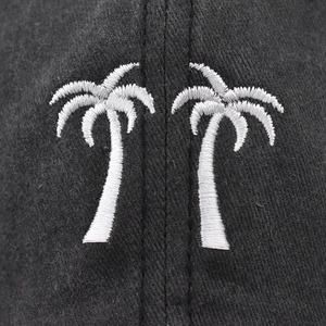 Washed black cotton baseball cap featuring high-quality white palm tree embroidery details