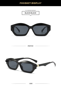 Detail view of black hexagonal sunglasses with gold metal hinge and high quality frame