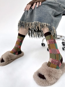 Detail of retro checkered crew socks featuring a colorful geometric color-block pattern