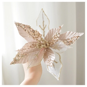 Detailed view of champagne gold flocked glitter poinsettia with shimmering sequins for Christmas