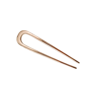 Minimalist U-shaped rose gold metal hair pin for elegant hair styling on white background