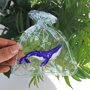 Rainbow suncatcher static sticker featuring a purple whale and starry laser prism pattern