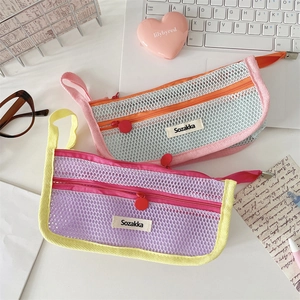 Close-up of double zipper mesh pencil cases with handles and breathable nylon fabric