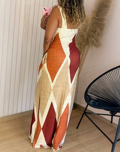 Detail of a geometric diamond pattern maxi dress with side slit and linen texture