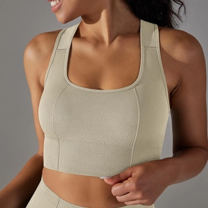 Close-up of seamless knitted sports bra featuring breathable honeycomb texture in beige