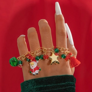 Christmas rings set featuring Santa Claus elk and bell pendants on golden open bands