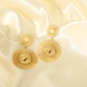 18K gold-plated stainless steel earrings with sunburst design on champagne satin fabric