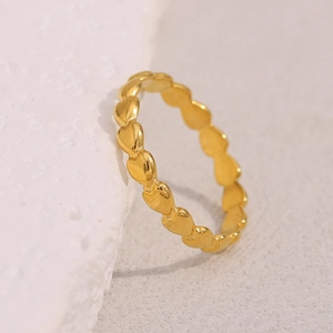 Detailed macro shot of 18K gold plated ring featuring a continuous heart-shaped band design