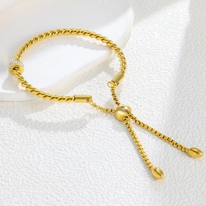 Vintage twisted gold titanium bracelet with sparkling zircon ring and adjustable slider