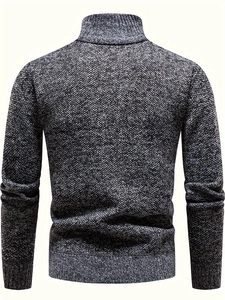 Back view of thick men's knit sweater featuring black gray marled texture and ribbed hem