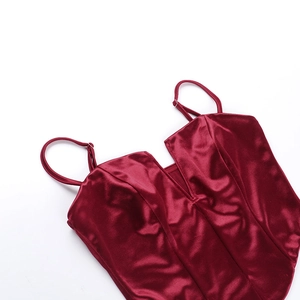 Detailed close-up of wine red satin camisole with V-neckline and adjustable straps