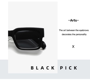 Detailed close-up of chunky black square frame sunglasses with silver rivet accents