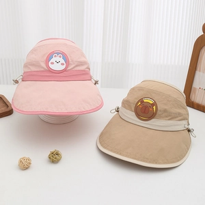 Detail of pink and khaki cartoon animal sun hats with adjustable straps for kids