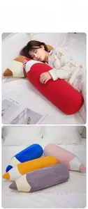 Detail showing colorful plush pencil pillows in soft fleece and corduroy fabric textures