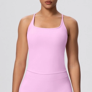 Pink athletic yoga tank top with thin shoulder straps and built-in bra pads for women