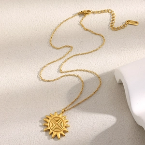 Close-up of 18K gold-plated stainless steel sun pendant necklace with lobster clasp detail