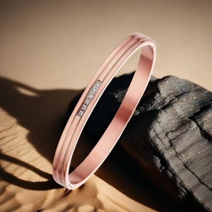 Detailed close-up of rose gold stainless steel bangle with six small inlaid diamonds