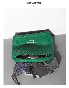 Top view of green woven bucket bag showing its large capacity and storage space