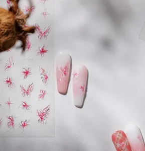 Close-up of pink 3D butterfly nail stickers with glass texture and delicate details.