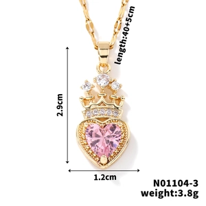 Detail view of gold crown heart necklace showing pendant dimensions 1.2cm x 2.9cm