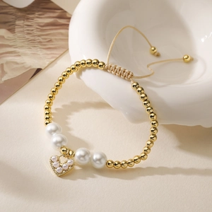 Elegant 18K gold plated beaded bracelet with heart pendant and white pearls detail