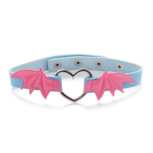 Detail of light blue leather punk choker with pink bat wings and heart-shaped metal ring