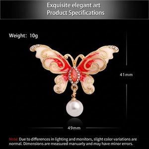 Elegant butterfly brooch with pearls and crystals in gold finish, 49mm x 41mm size
